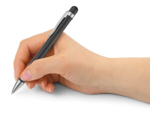An image of a person's hand writing with The Philips VoiceTracer Recorder Pen — a regular pen with a mic at the top. 