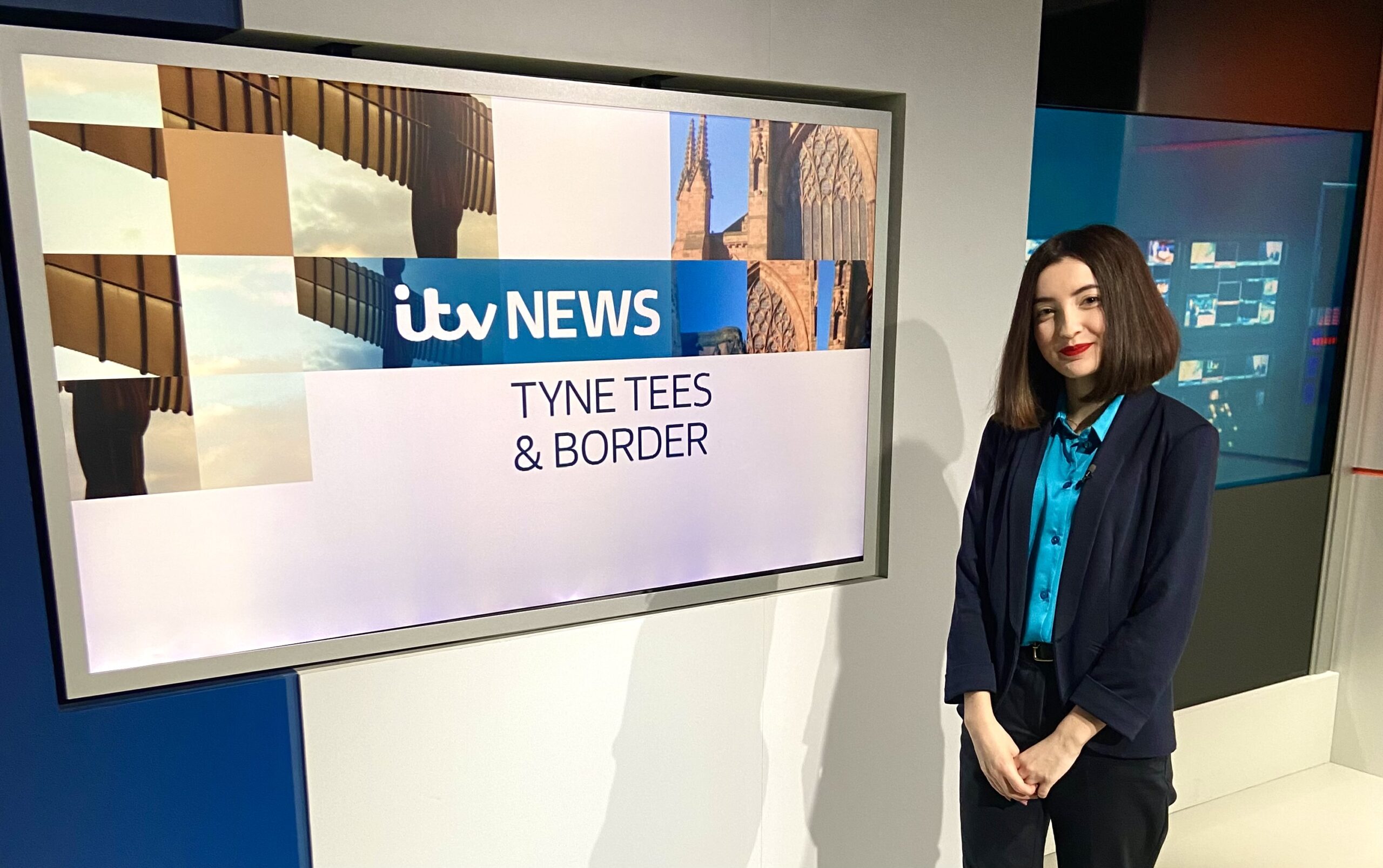 Lauren stands in front of a screen which reads ITV Tyne Tees & Borders